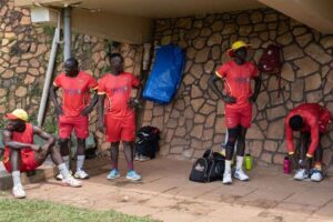 The Uganda players take a break from a training session -AFP/Getty Images